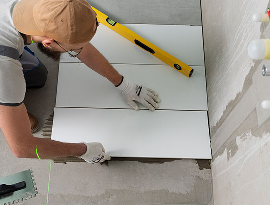 man-tiling-floor-in-berkshire